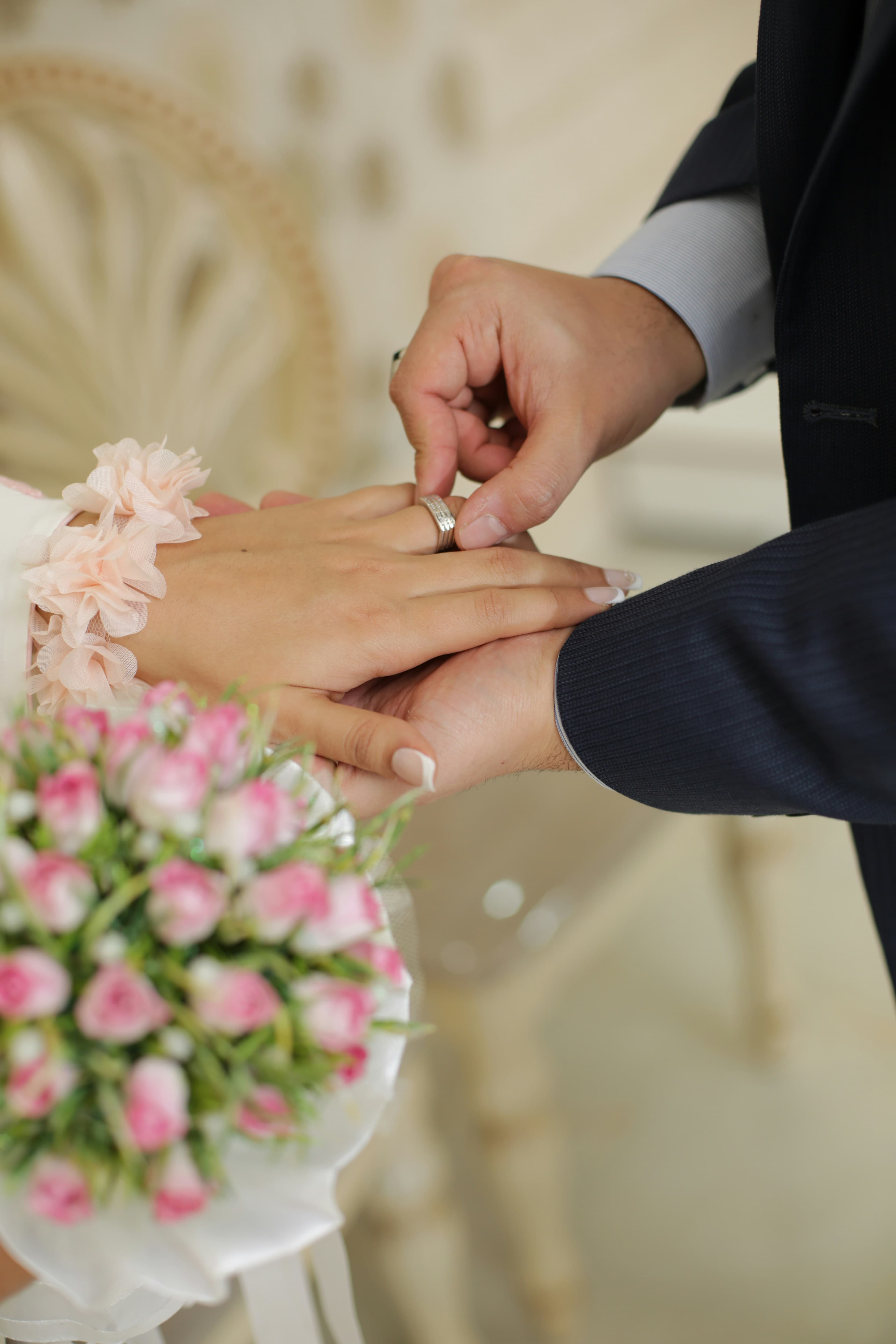 A wedding ring ceremony with soft flowers